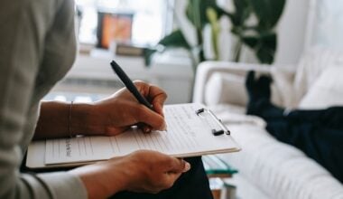 psychologist writing on clipboard during session