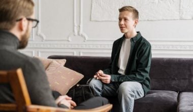 young man speaking to therapist