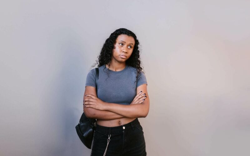 sad girl standing with arms crossed