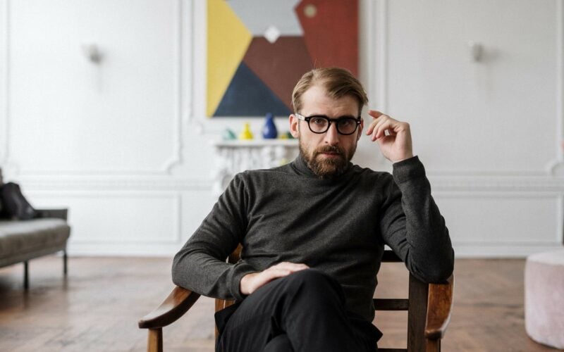 man looking ahead wearing glasses