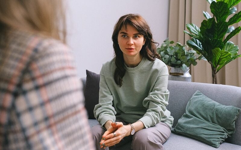 female patient talking to therapist